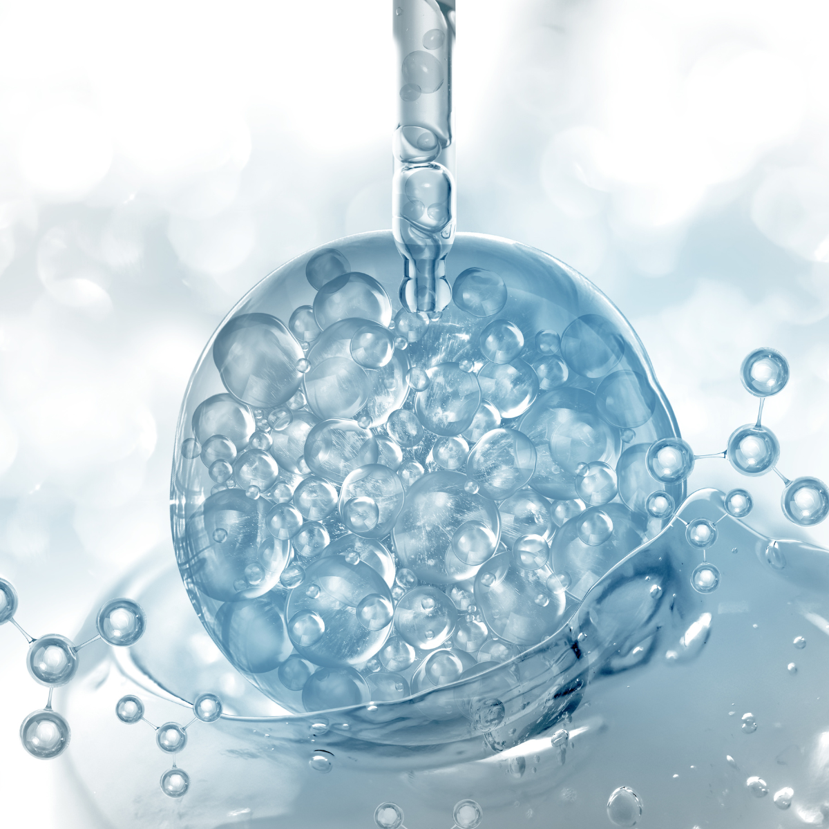 Dropper touching a molecular bubble splashing in dripping serum