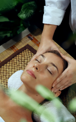 a woman receiving a head massage