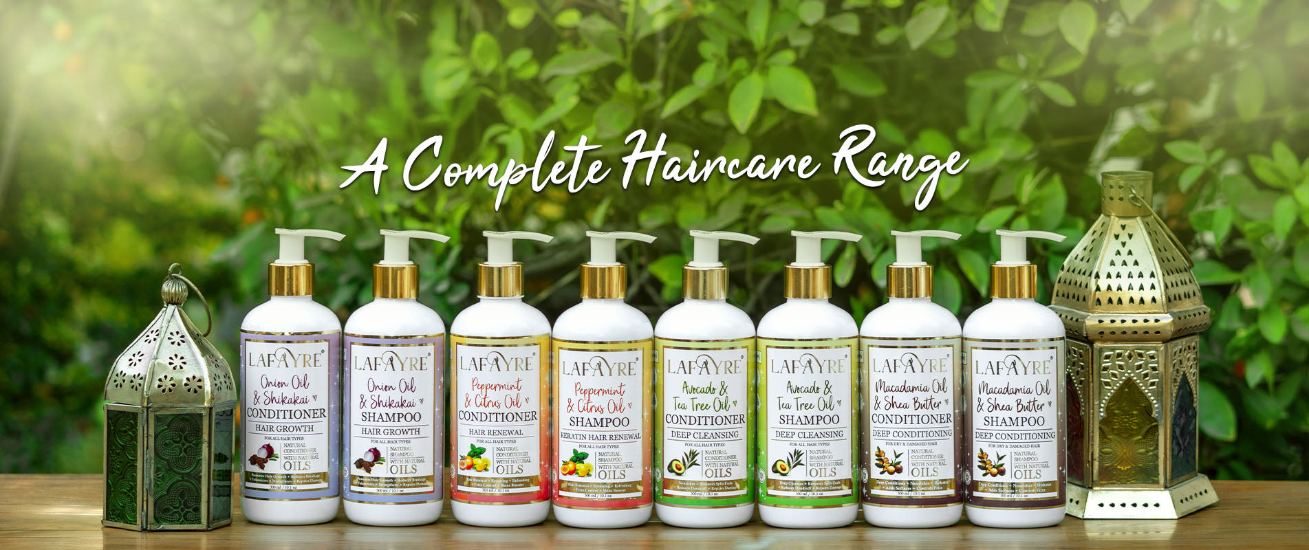 a group of 8 bottles of lafayre shampoos and conditioners with natural background